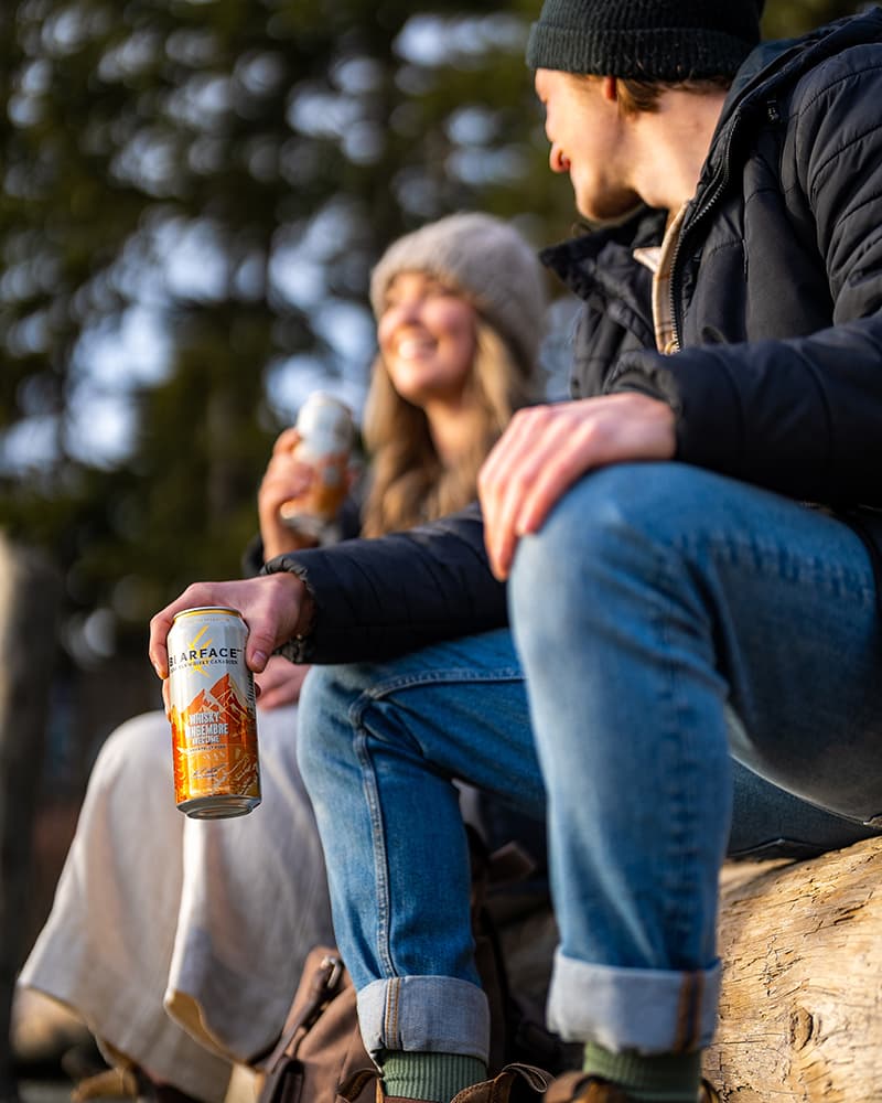 Enjoying Bearface canned cocktails in the wilderness